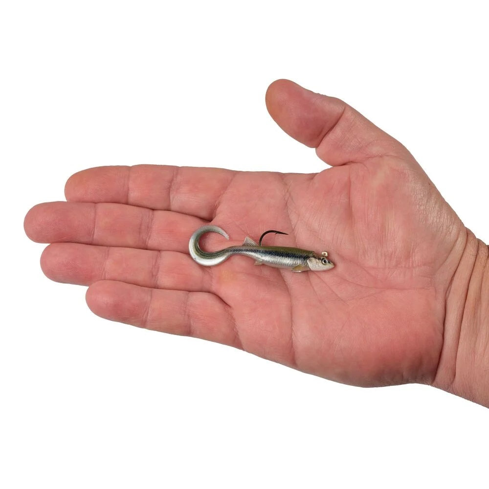 A hand holding a 2.5 inch Berkley PowerBait Minnotator Grub that is green and black with a white belly.