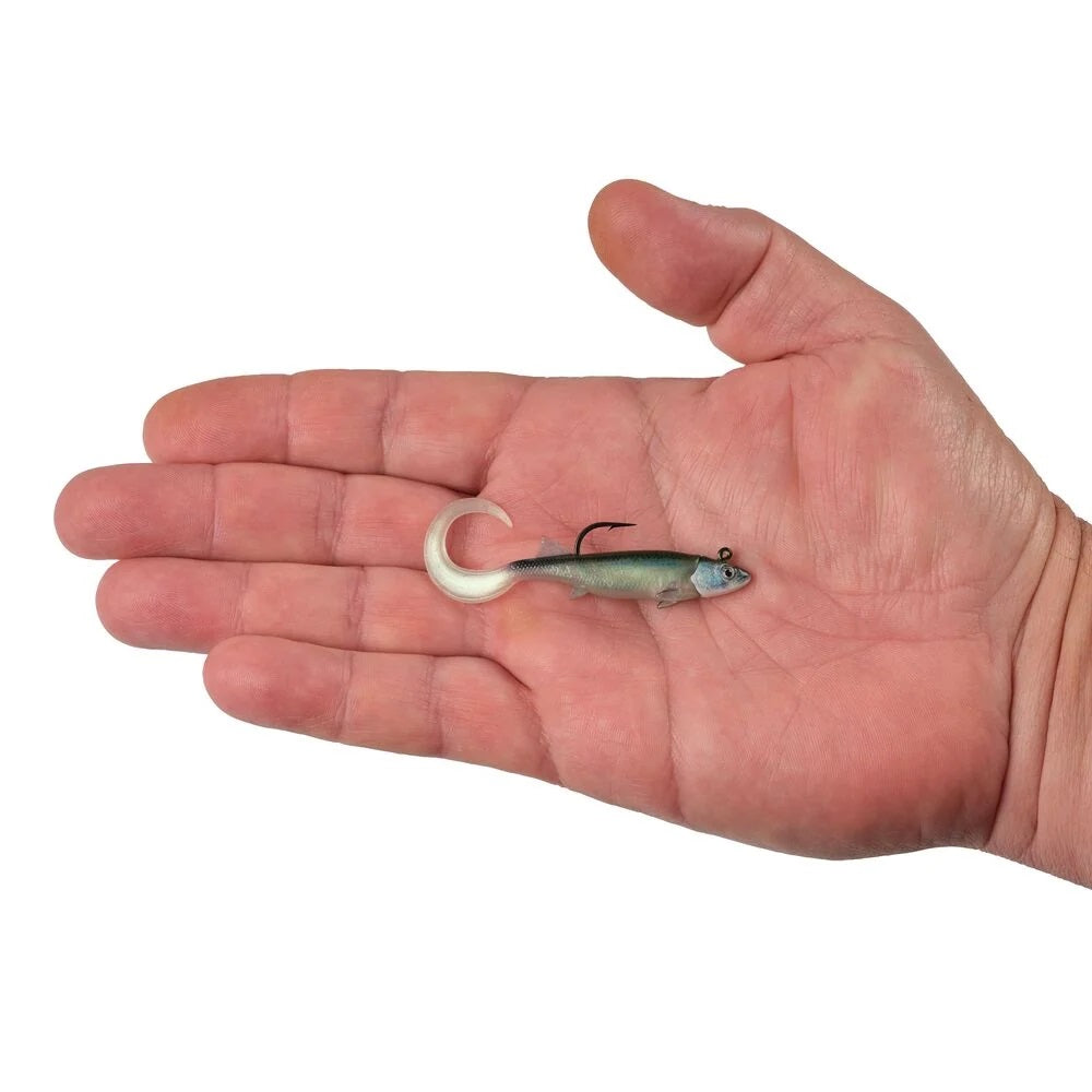 A hand holding a 2.5 inch Berkley PowerBait Minnotator Grub that is green with a white belly.