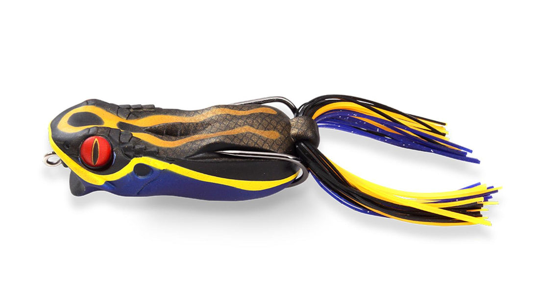 A Megabass Gabarin Jr. Frog fishing lure that is black, yellow, and blue.