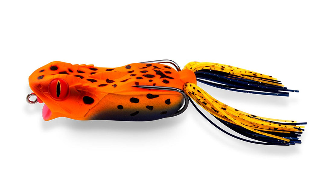 A Megabass Gabarin Jr. Frog fishing lure that is orange with black spots.