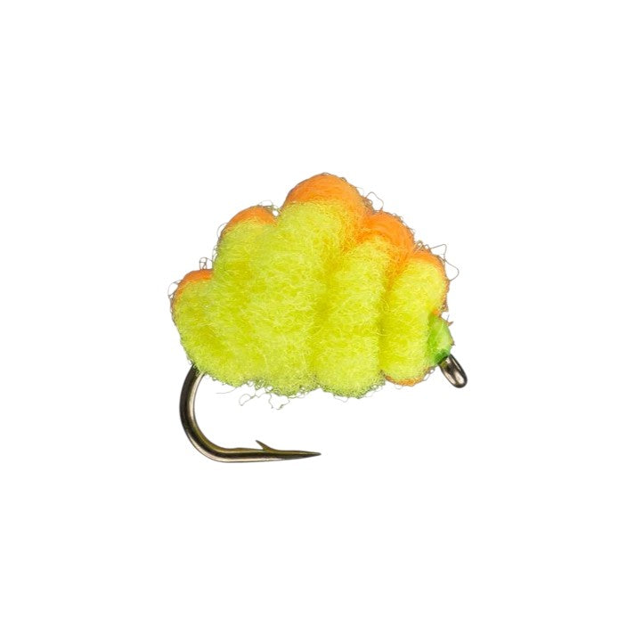 A Rio size 12 Micro Spawn fly that is green and orange.