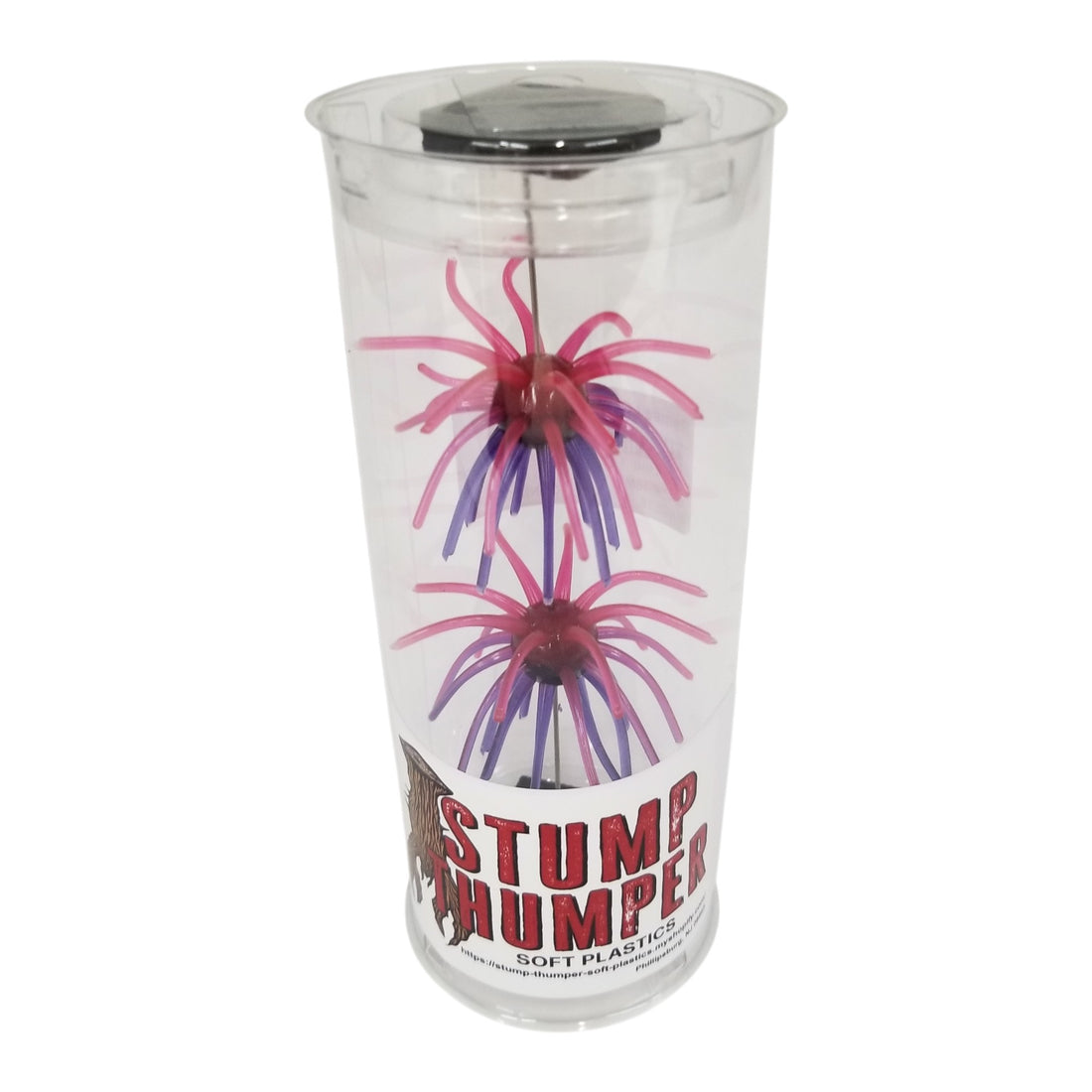 A pack of 2 16 millimeter Stump Thumper Soft Plastics Mace Fuzzy Ball Baits that are pink and purple.